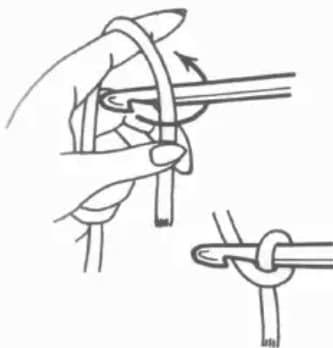 Chain stitch step 1: Hook picks up yarn forming a cross